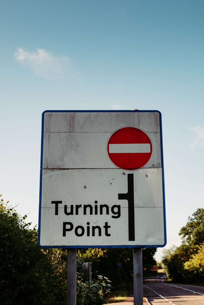 Road sign indicating turning point